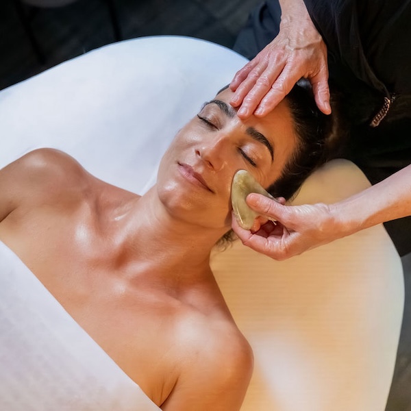 Therapist applying a body treatment enhancement